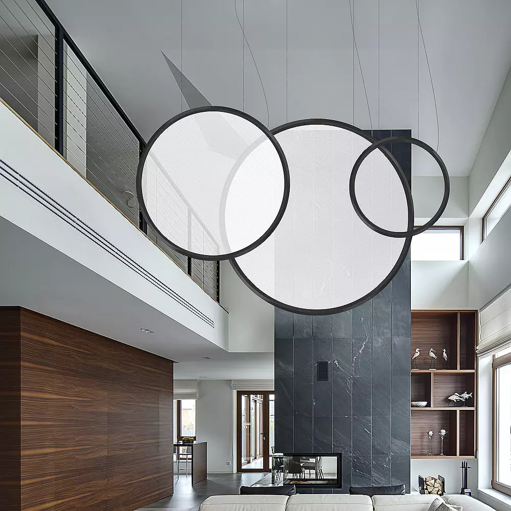 Discovery LED Vertical Suspension light in an open living room.