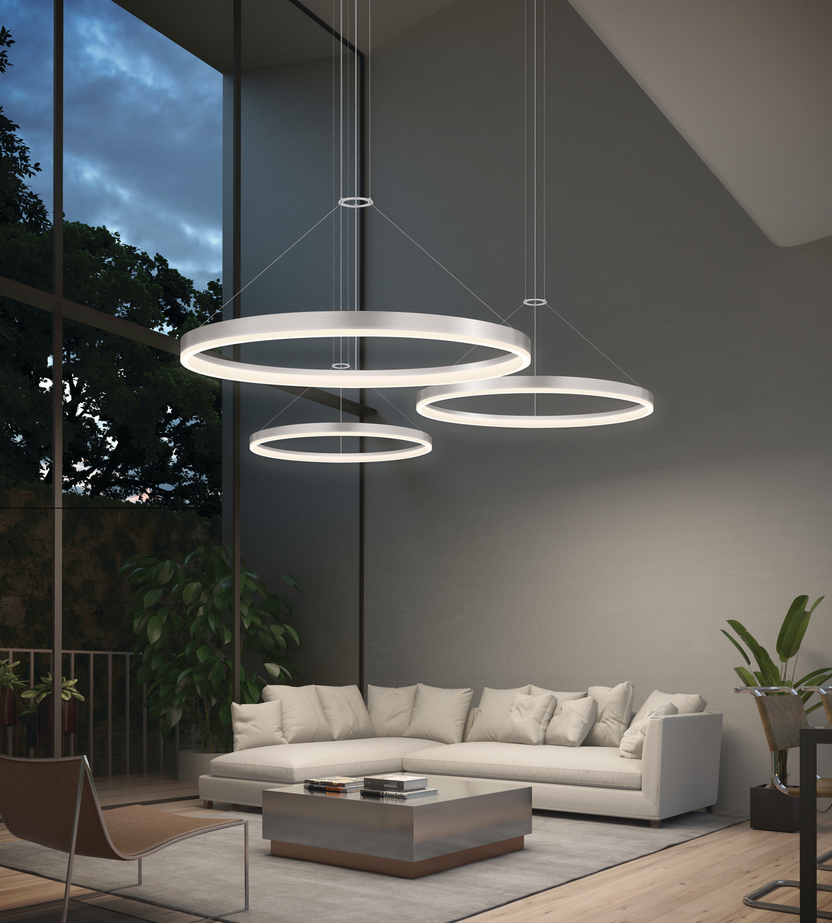 Three circular lighting fixtures over white leather sectional sofa