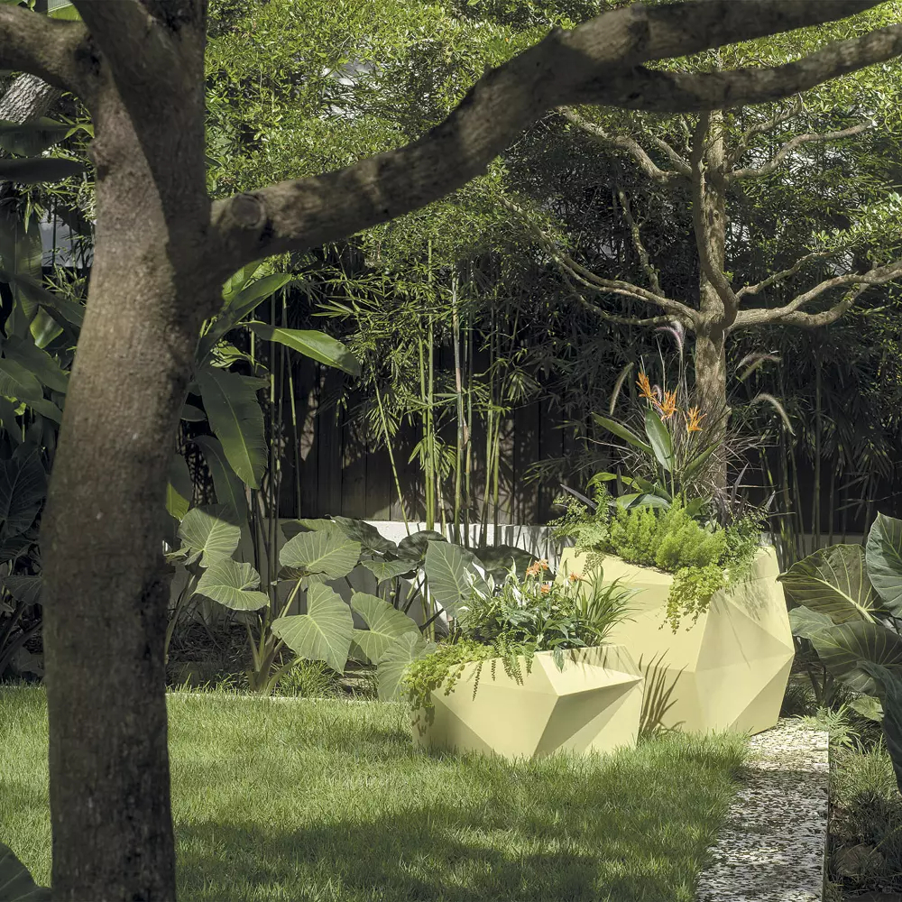 White planter in outdoor garden scene