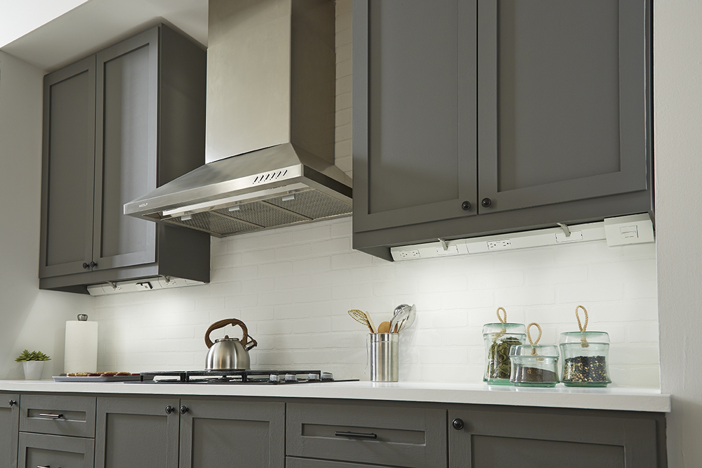 Legrand Undercabinet Collection near a stovetop.