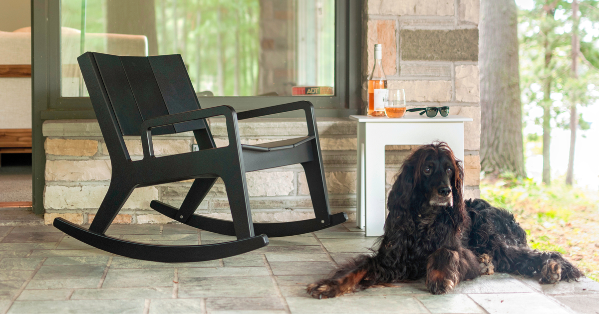 Reclaimed wood black rocking chair shown outdoors