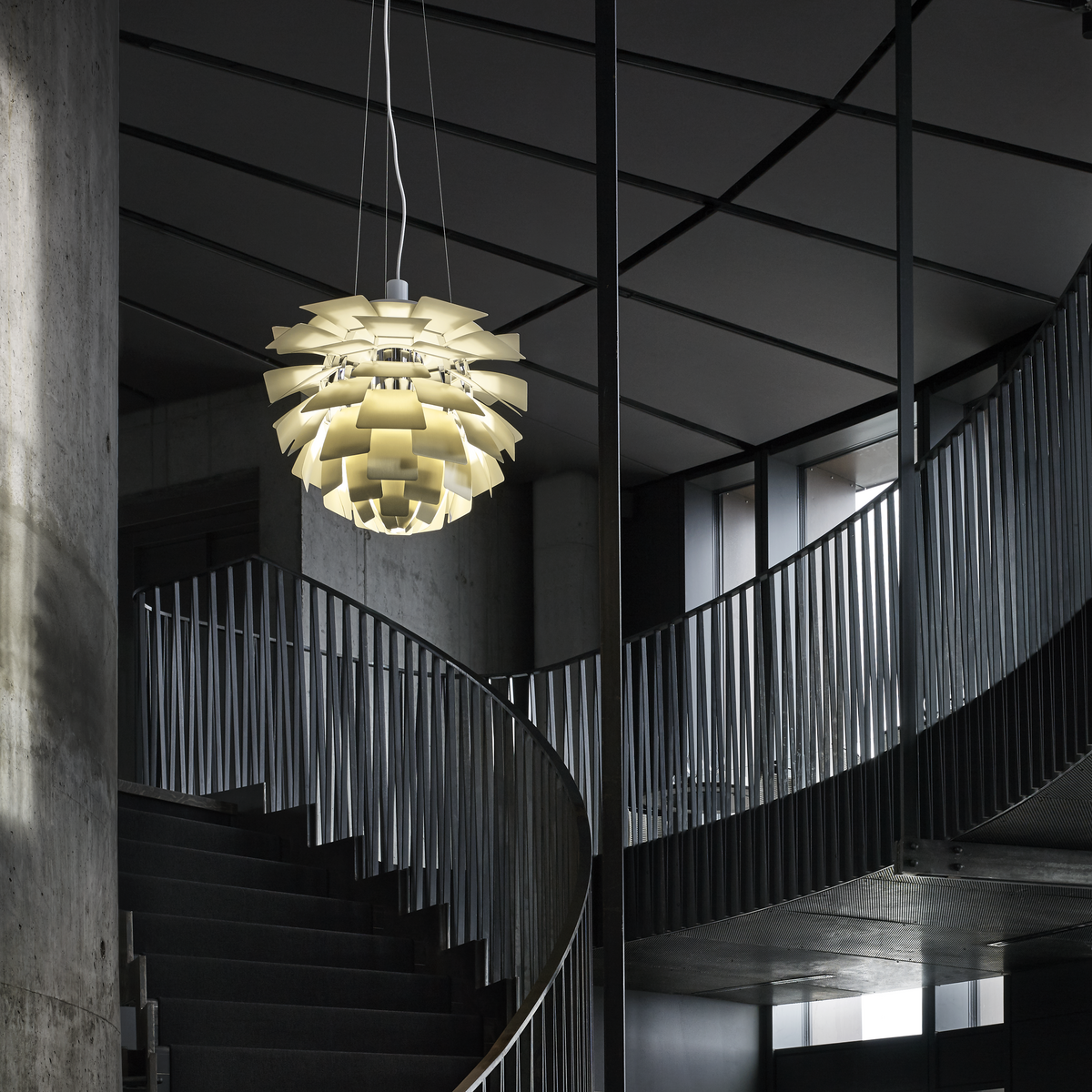 An elegant staircase and an iconic pendant.