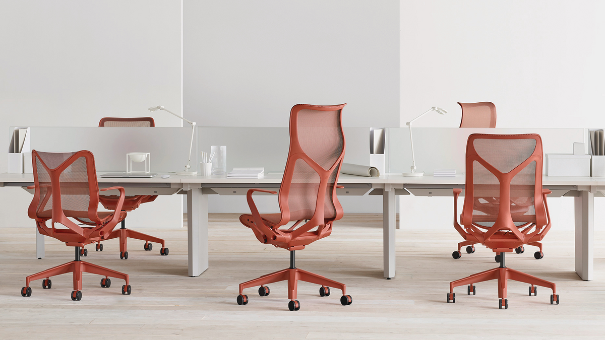 Short, mid and tall red office chairs in white office setting