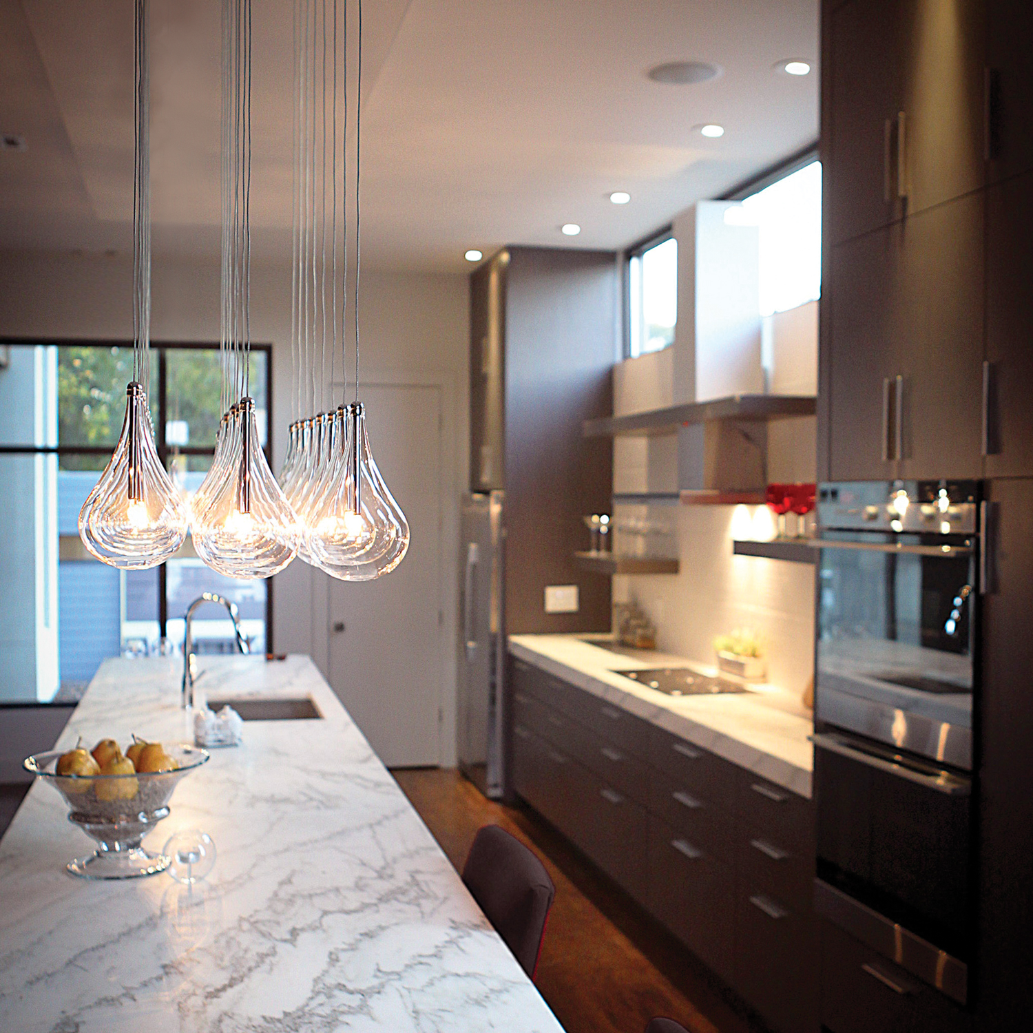 Larmes 24-Light LED Linear Suspension in a modern kitchen.