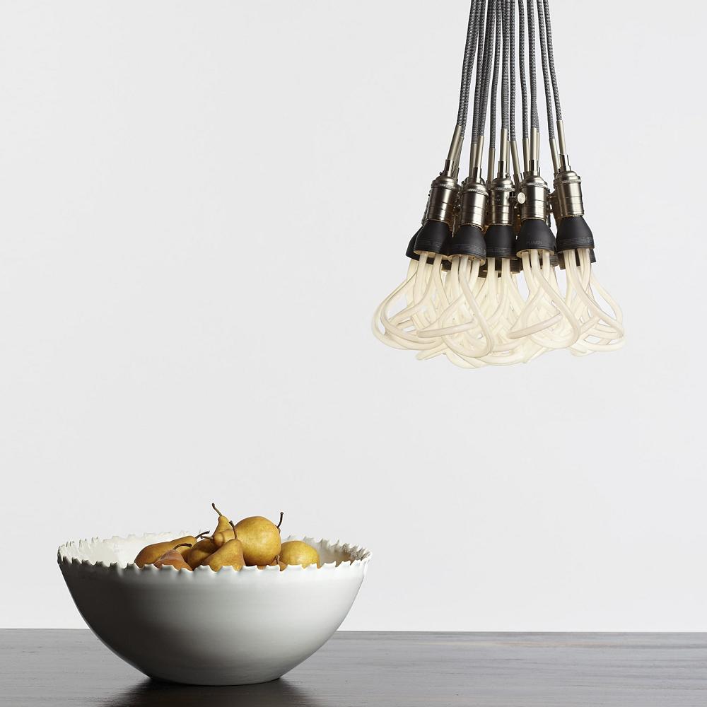 SoCo Modern Socket Pendant by Tech Lighting with a bowl of fruit.