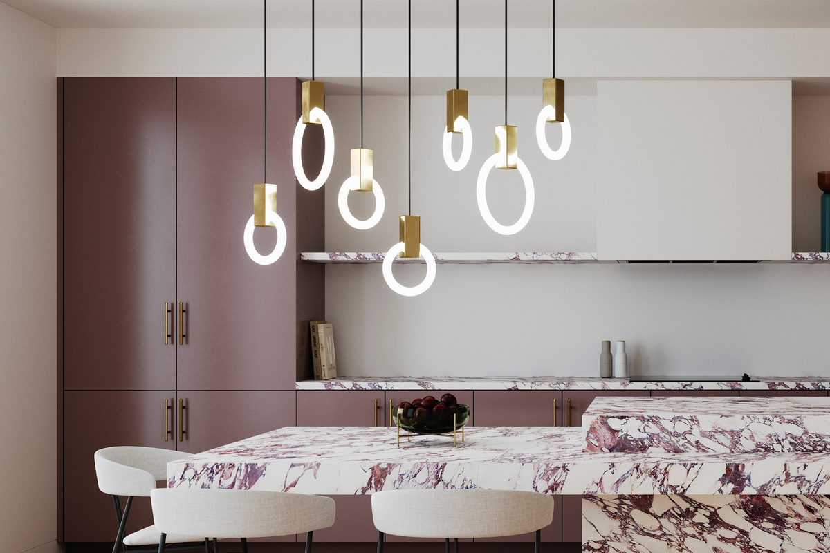 Kitchen with purple veined marble counter tops, and linear suspension with seven suspended rings attached by gold blocks. 