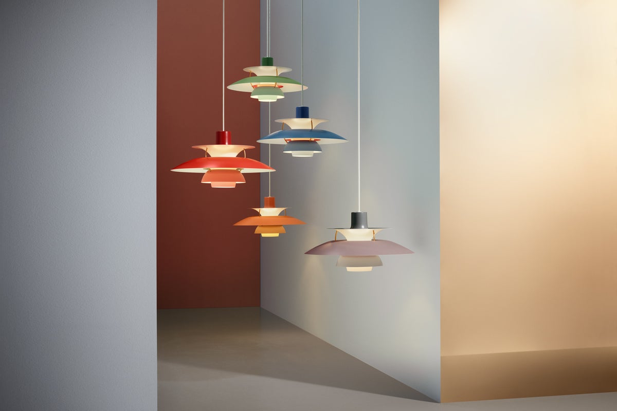 Multi-colored hanging Louis Poulsen lights in narrow hallway