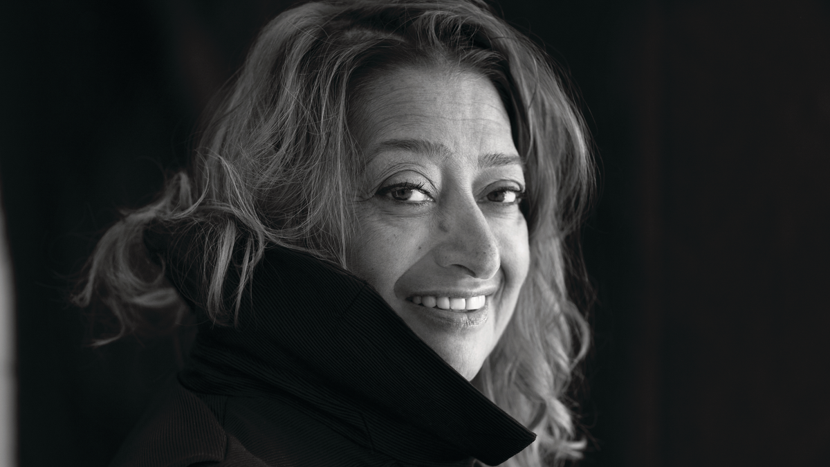 Black and white photo of designer and architect, Zaha Hadid