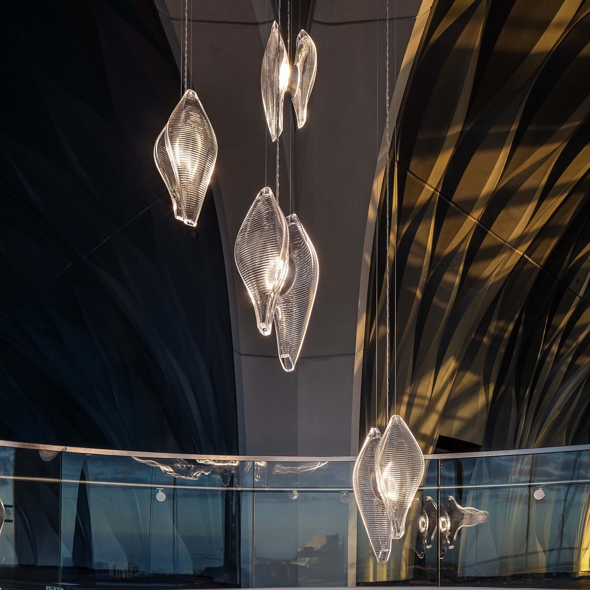 Glass hanging pendants in large architectural space