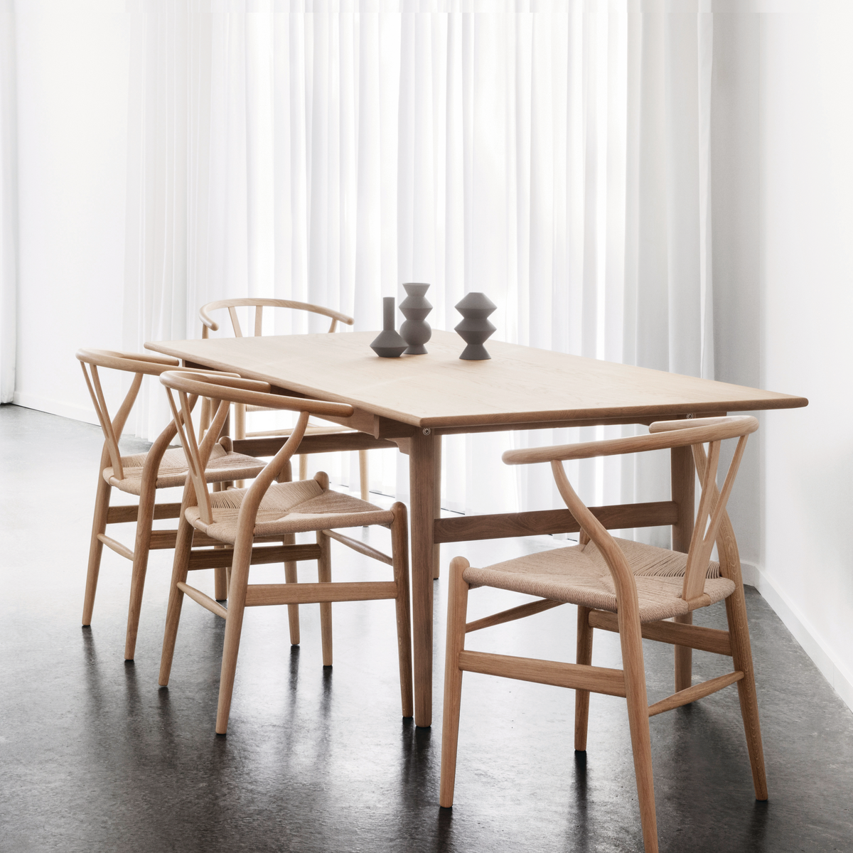 Wood chairs match with wood table in dining space.