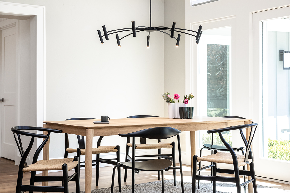 Light wood furniture with black accent dining room.