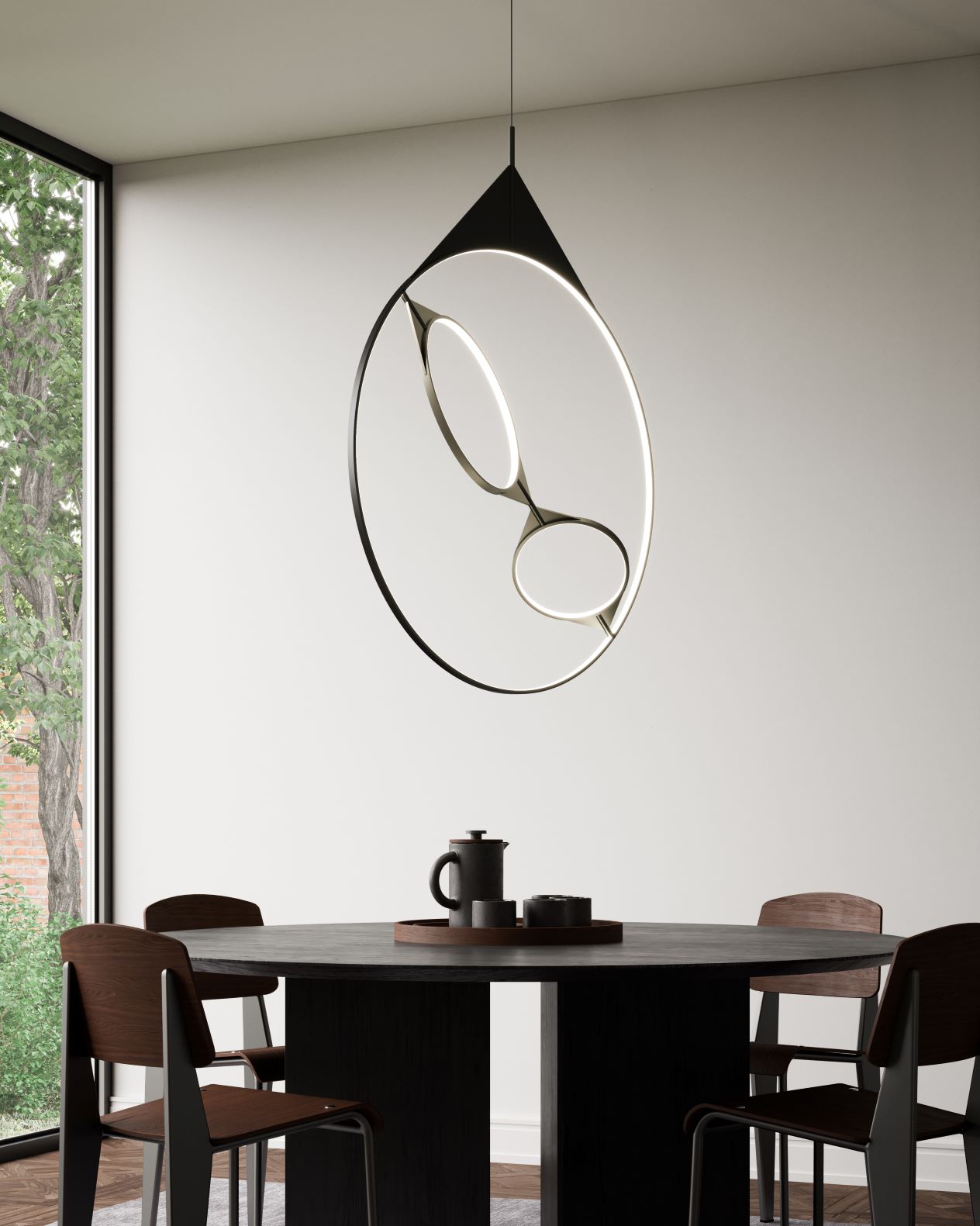 Serif LED Pendant above a round dining table.
