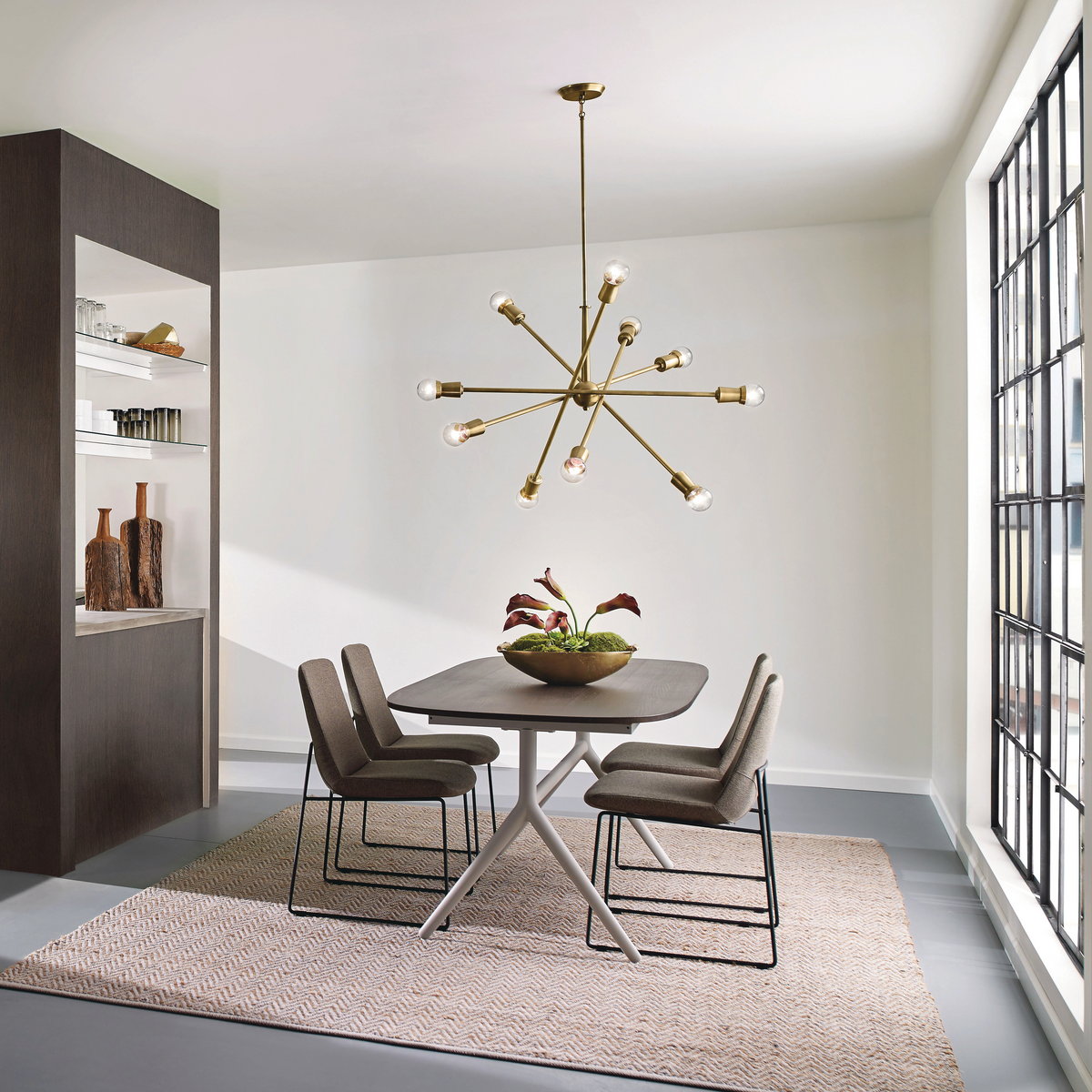 A clean dining space with natural centerpiece