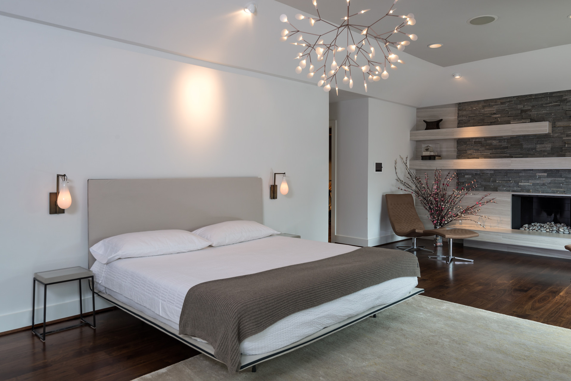 Heracleum II LED Chandelier by Bertjan Pot above a bed.