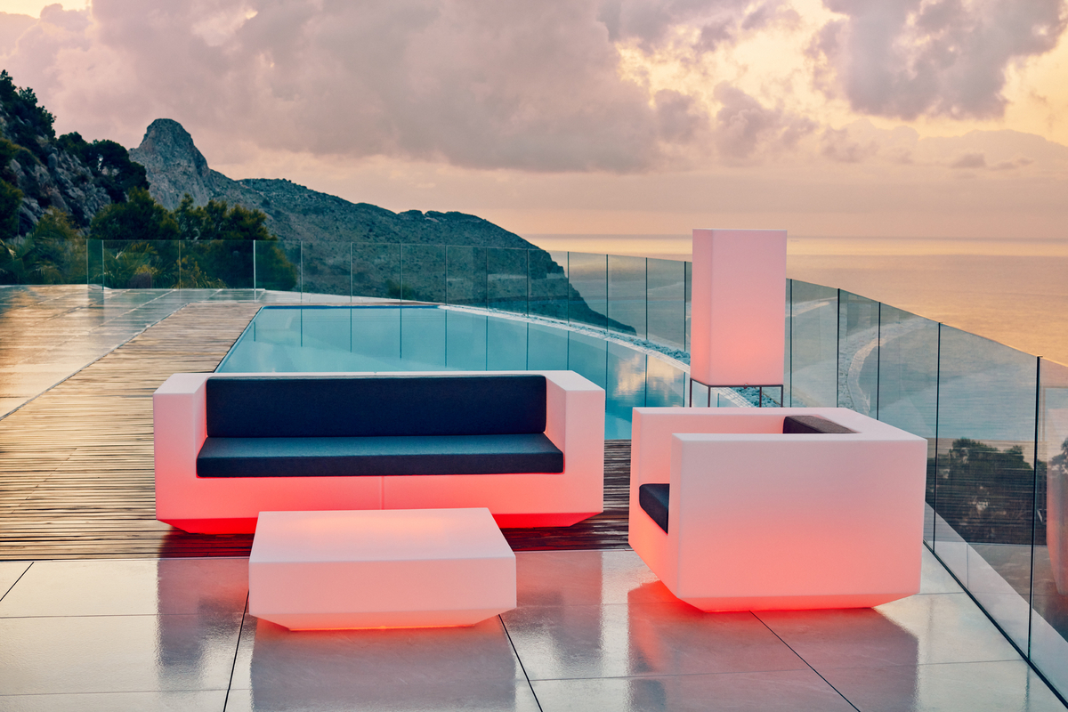 Coral illuminated outdoor furniture on deck featuring a cliffside view