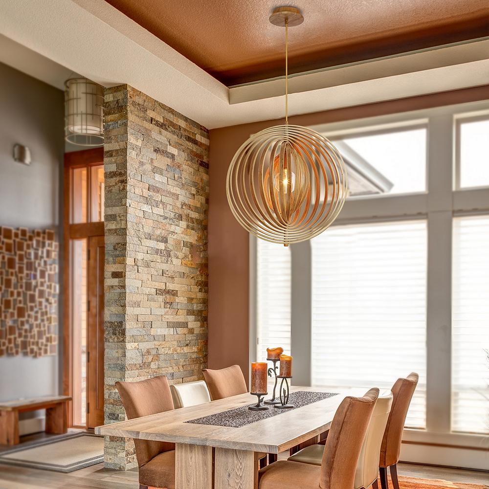A spherical pendant complements the color of the dining space below.