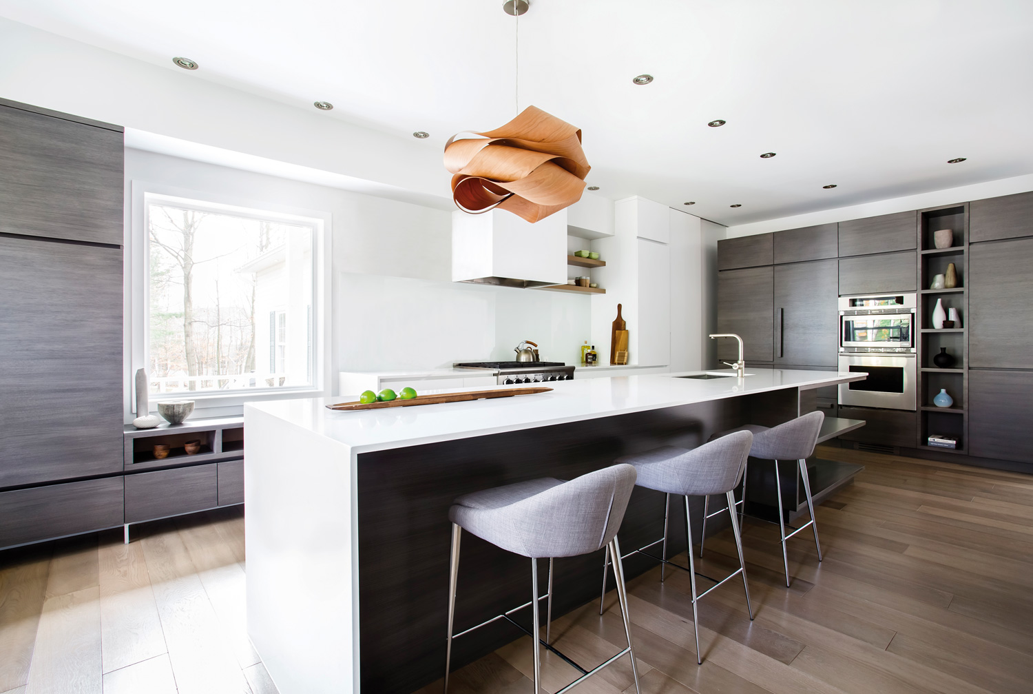 Stylish Link Pendant by LZF over a kitchen island.