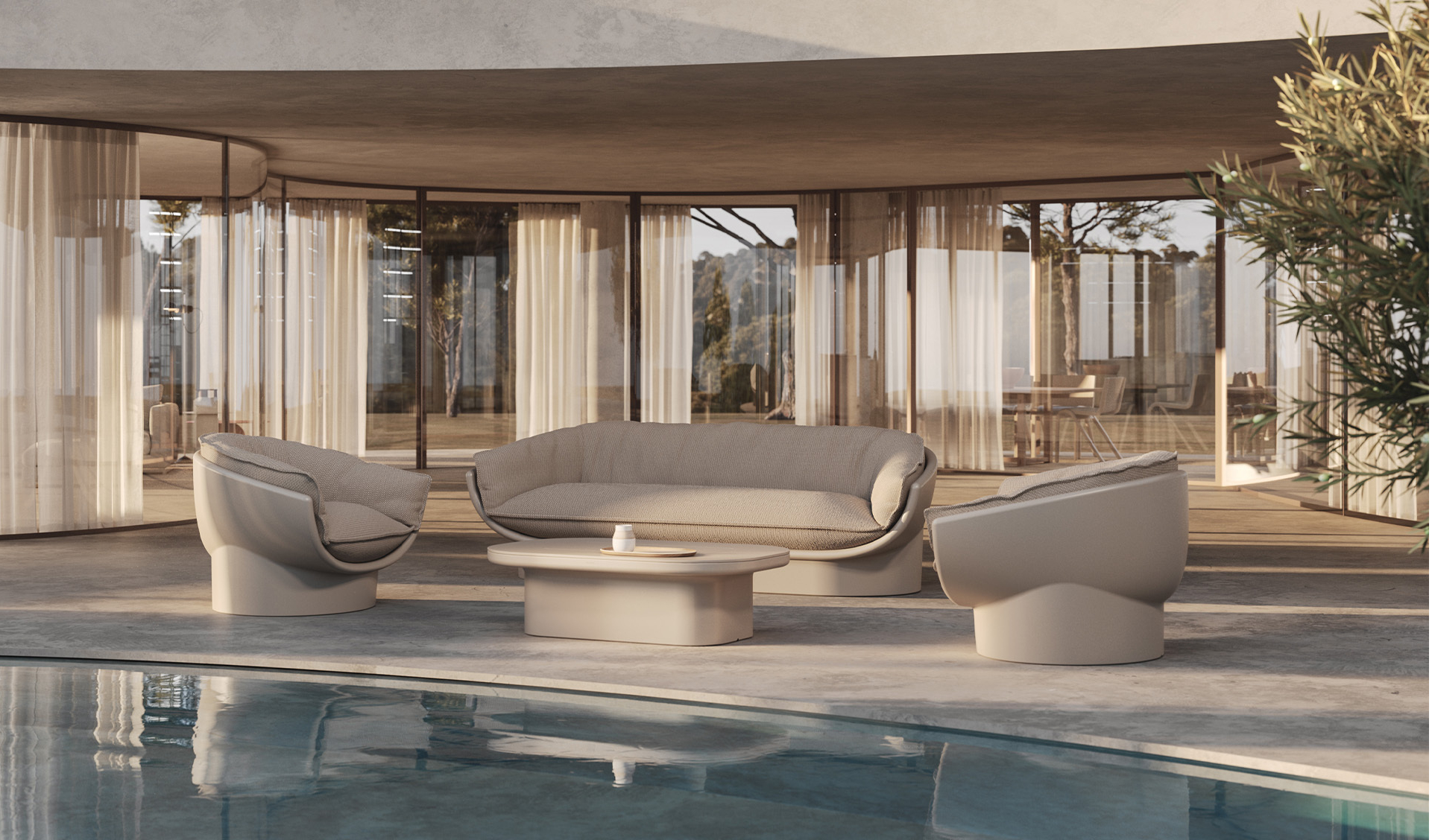 Chic modern outdoor sofa, lounge chairs, and coffee table in front of a contemporary home with large glass windows.