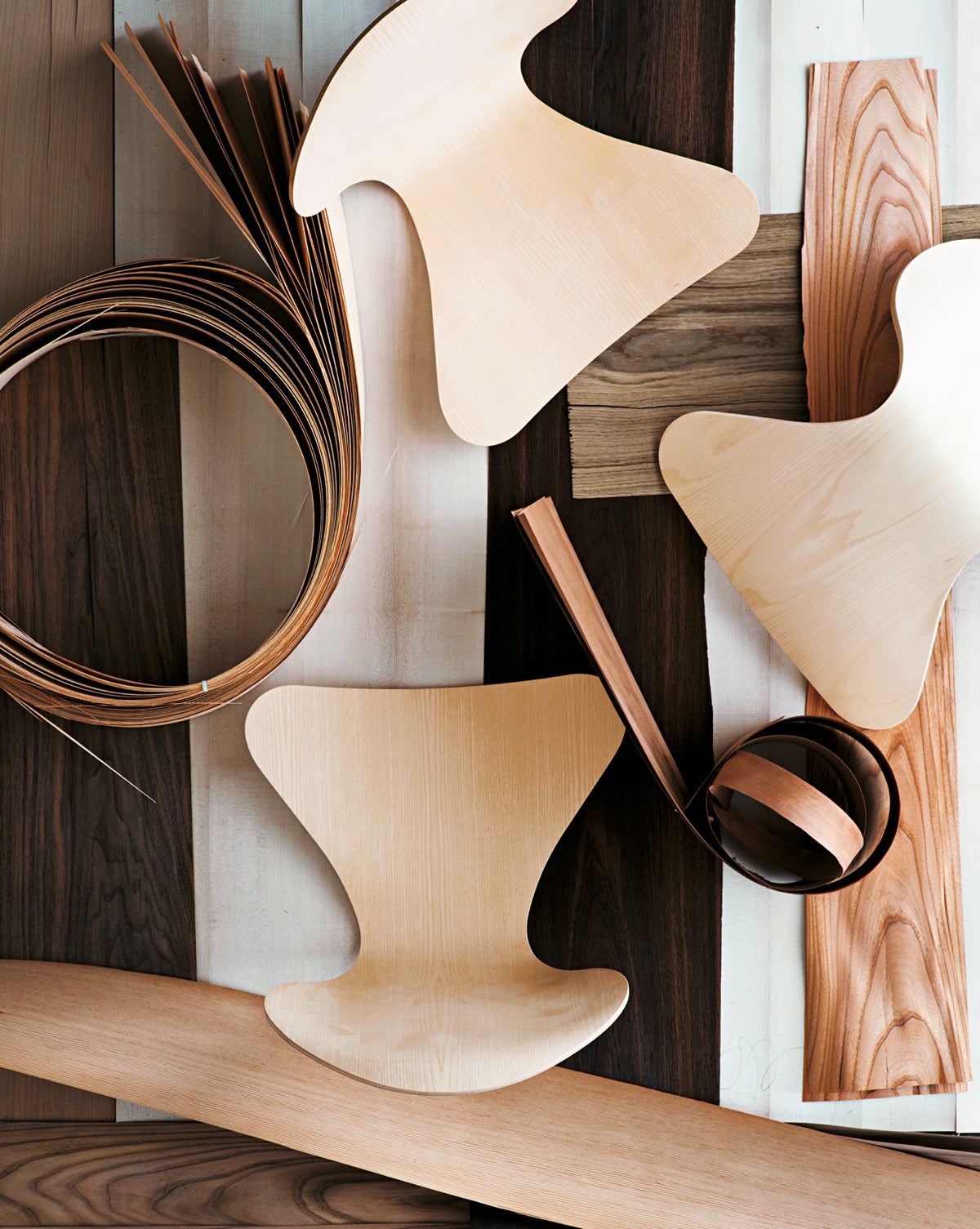 Many pieces of natural wood that construct an iconic Danish chair