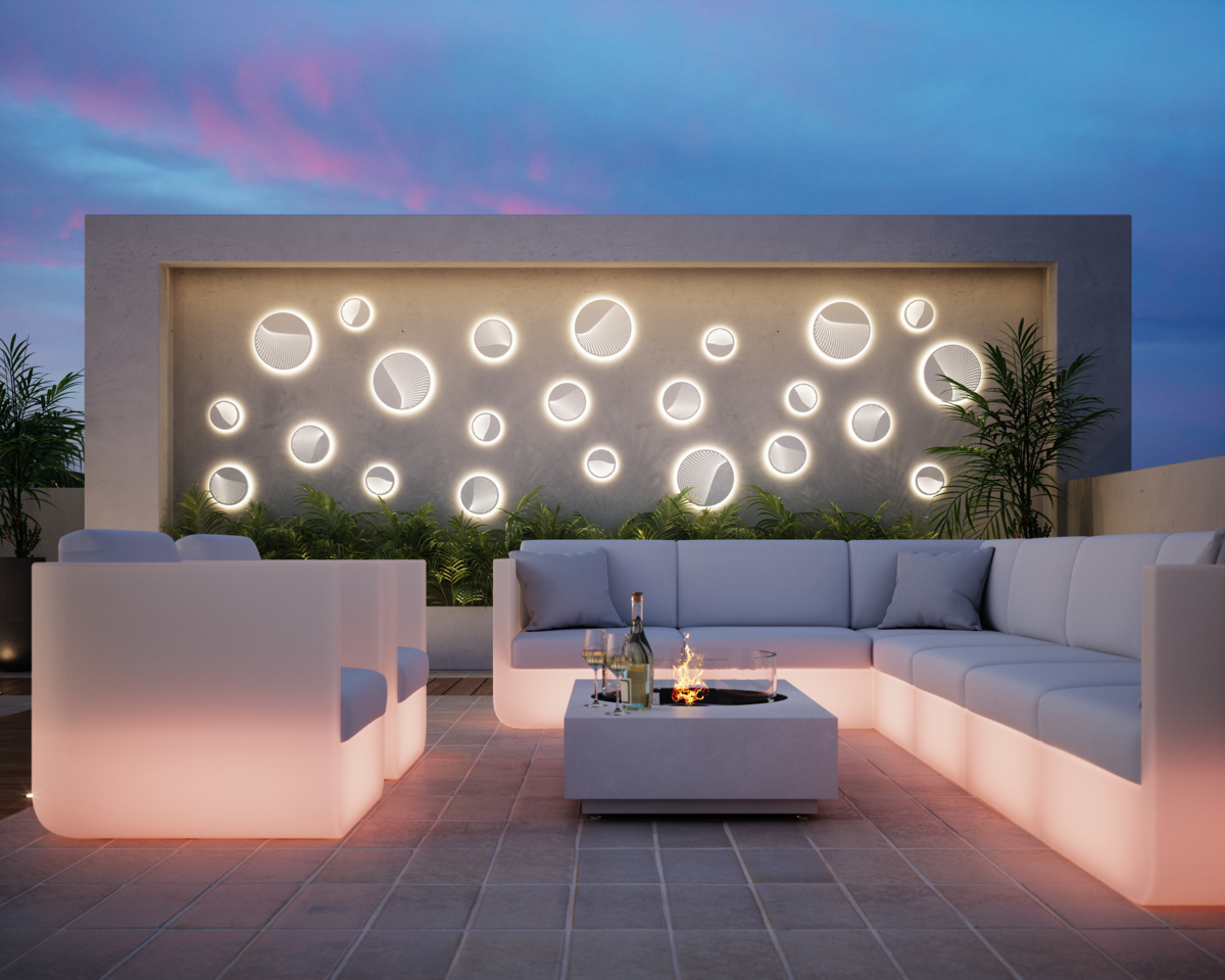 Outdoor entertaining area with large couches and wall lighting