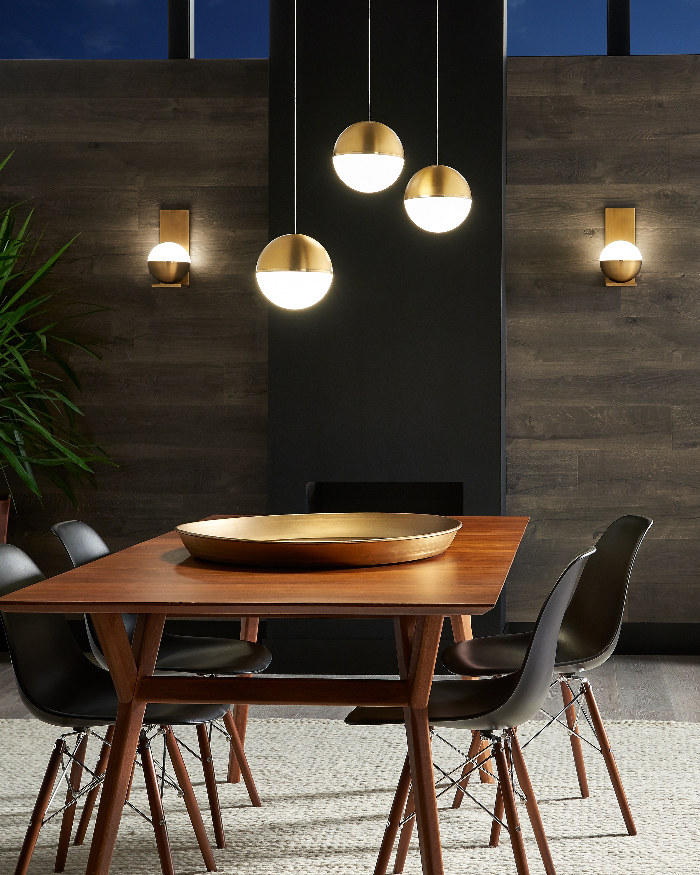 Akova LED Mini Pendants above a wooden dining table.