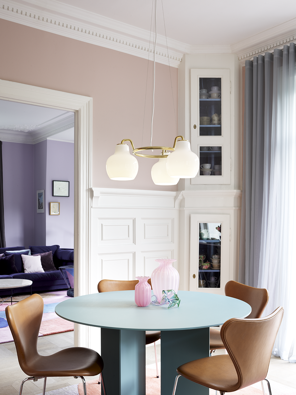 VL Ring Crown Chandelier by Louis Poulsen over a dining table in a Danish apartment.