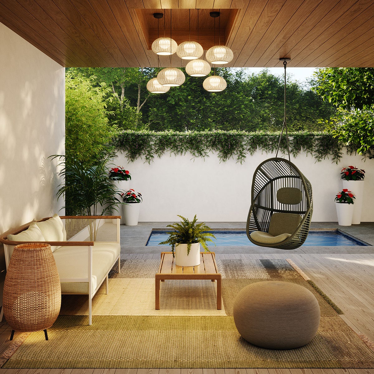 Outdoor patio scene filled with natural materials, a pool in the background, and lots greenery