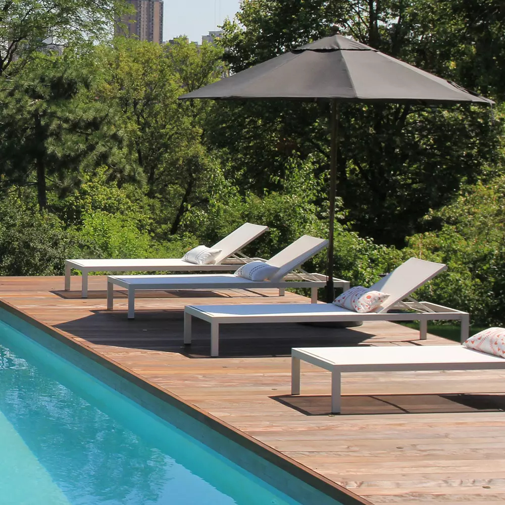 Aluminum lounge chairs poolside.