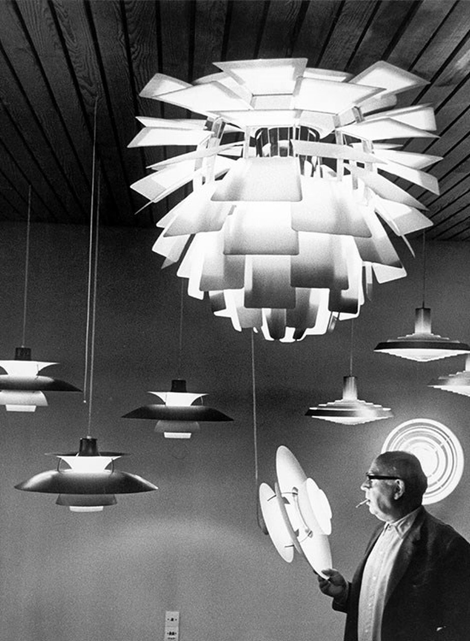 Poul Henningsen with his designs