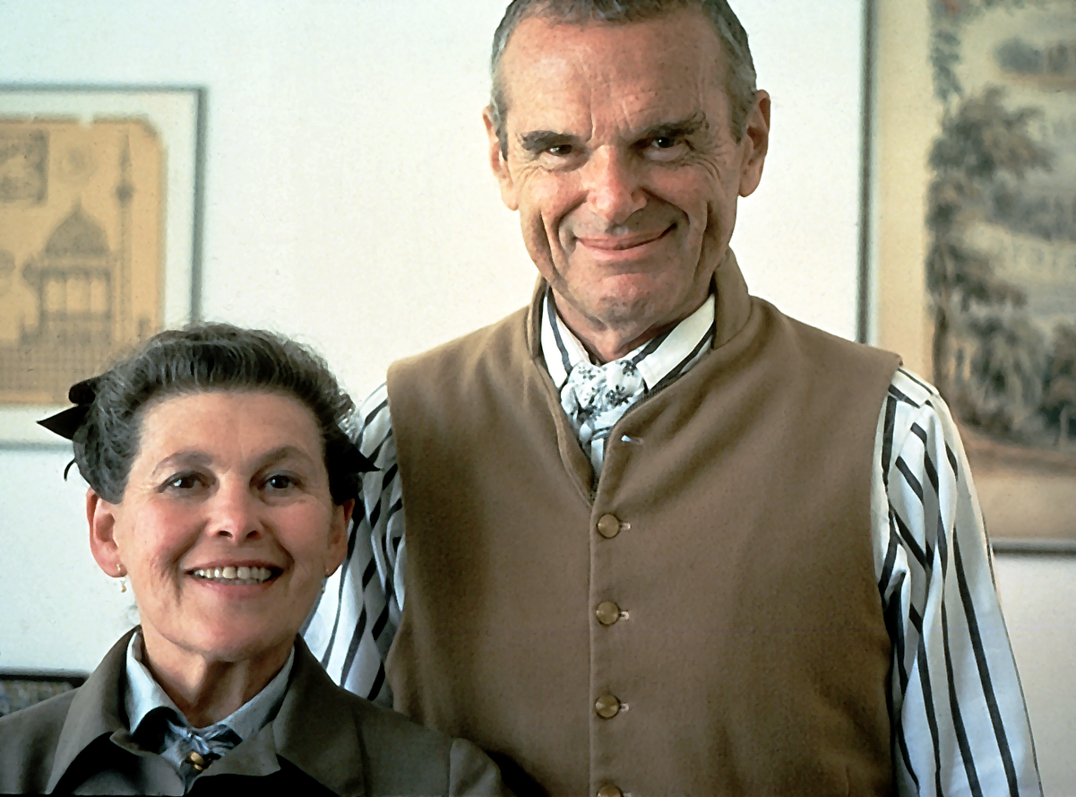 Image of Ray and Charles Eames later in life, both smiling contentedly
