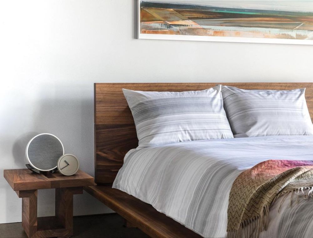 Bedroom with simple endtable and clock.