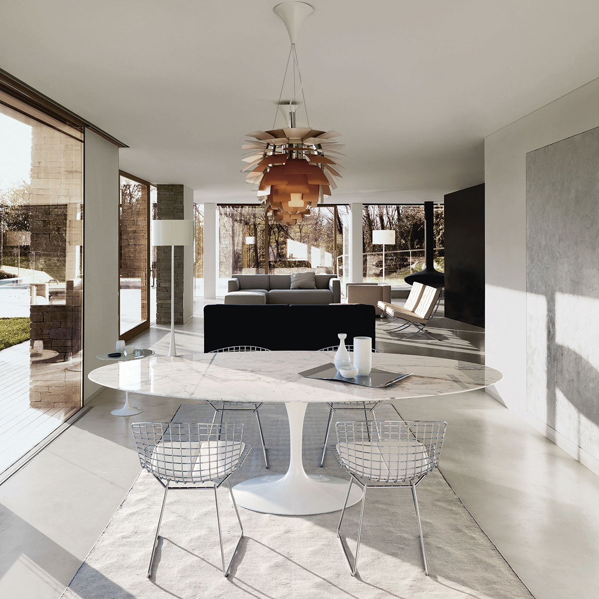 A dining space and lounge area bathed in natural light.