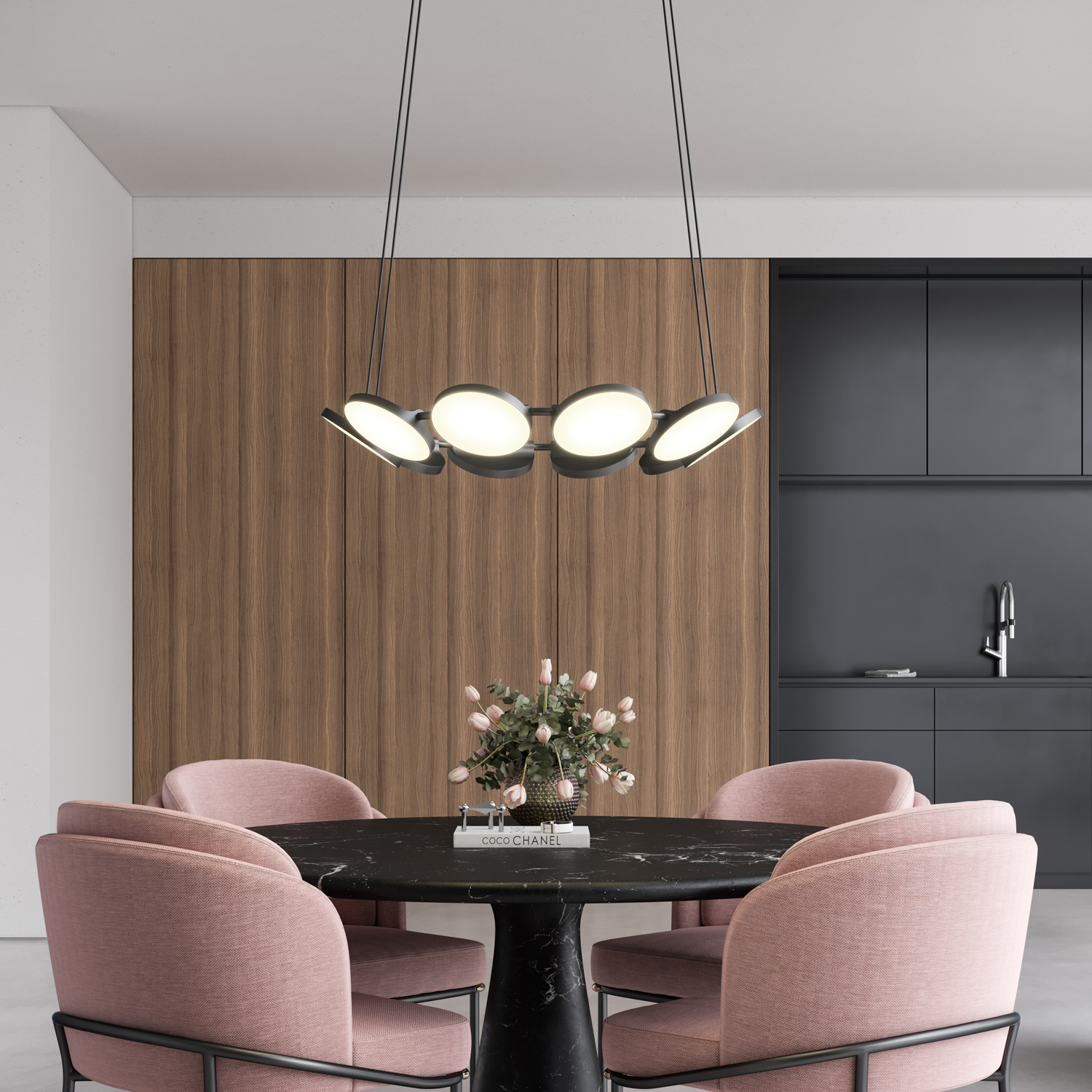 Novel LED Chandelier above a round dining room table.