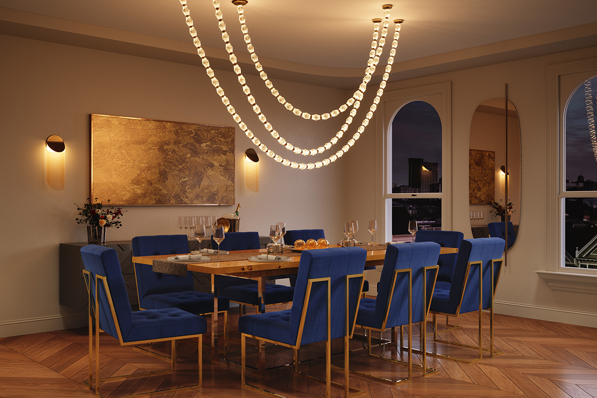 Jewelry style lighting over dining scene with blue velvet chairs