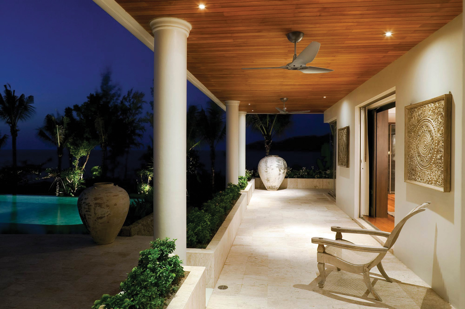 Haiku Outdoor Ceiling Fans under a covered patio.