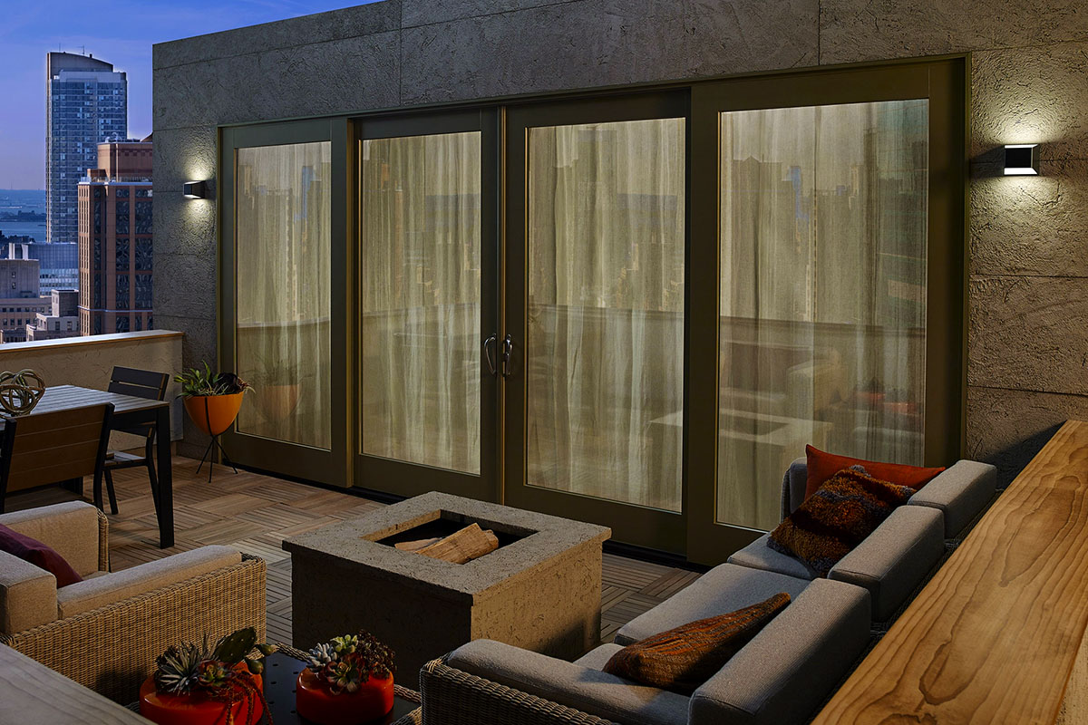 Ebb LED Outdoor Wall Sconce lighting a patio.