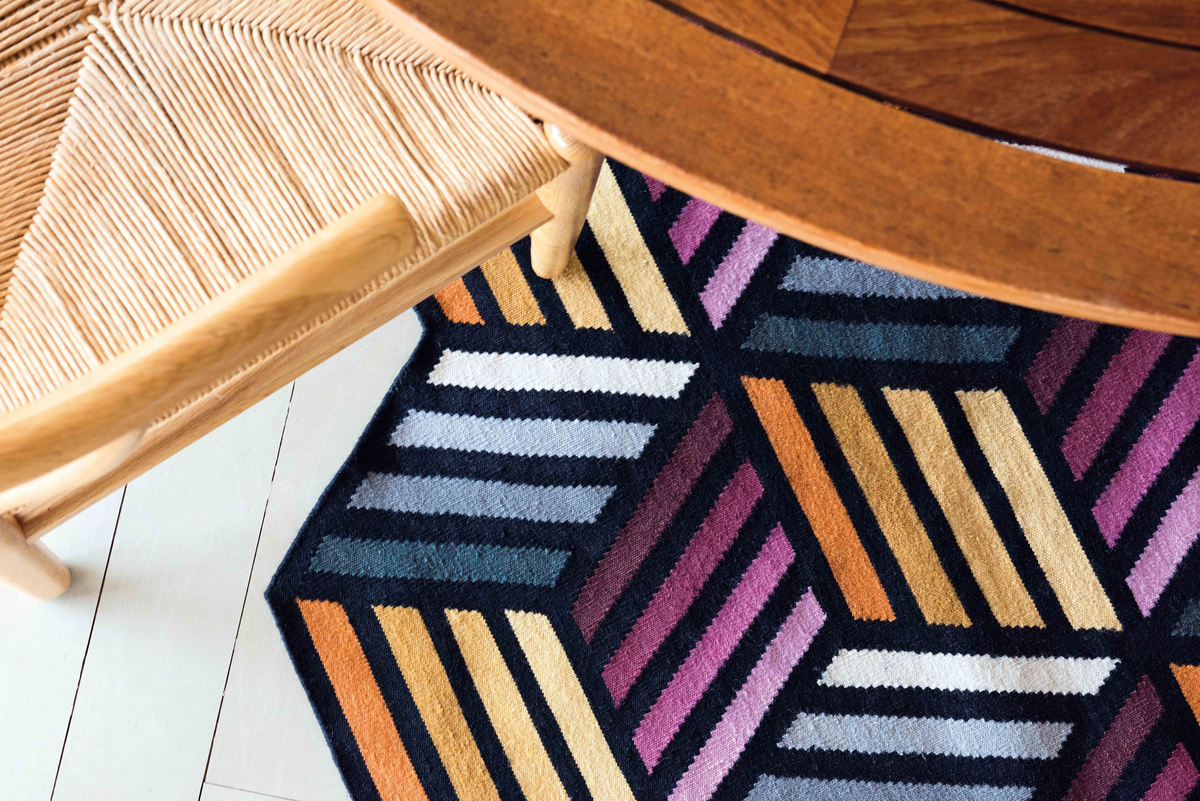 A colorful, abstract rug design.
