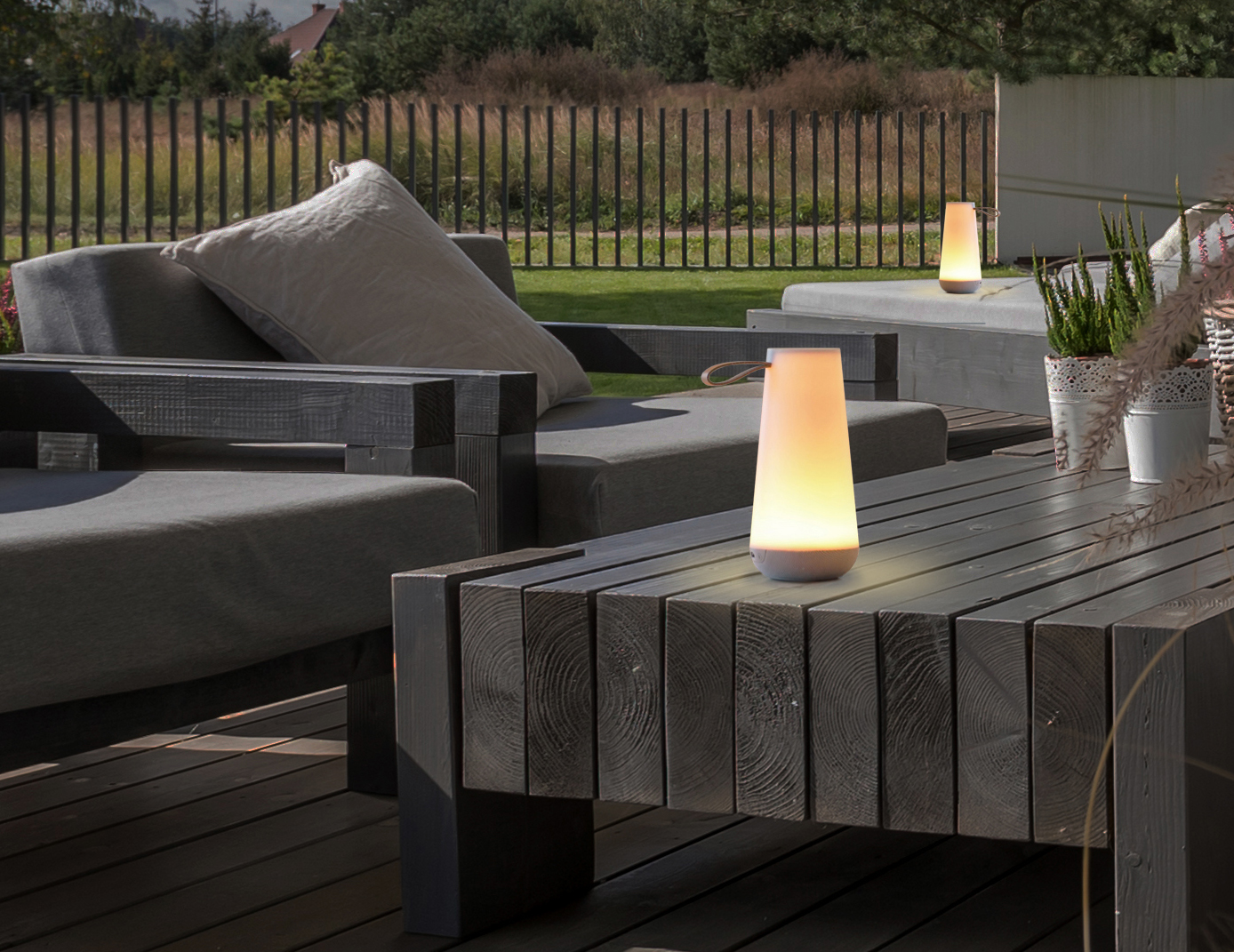 Uma Mini LED Table Lamp in an outdoor lounge setting.