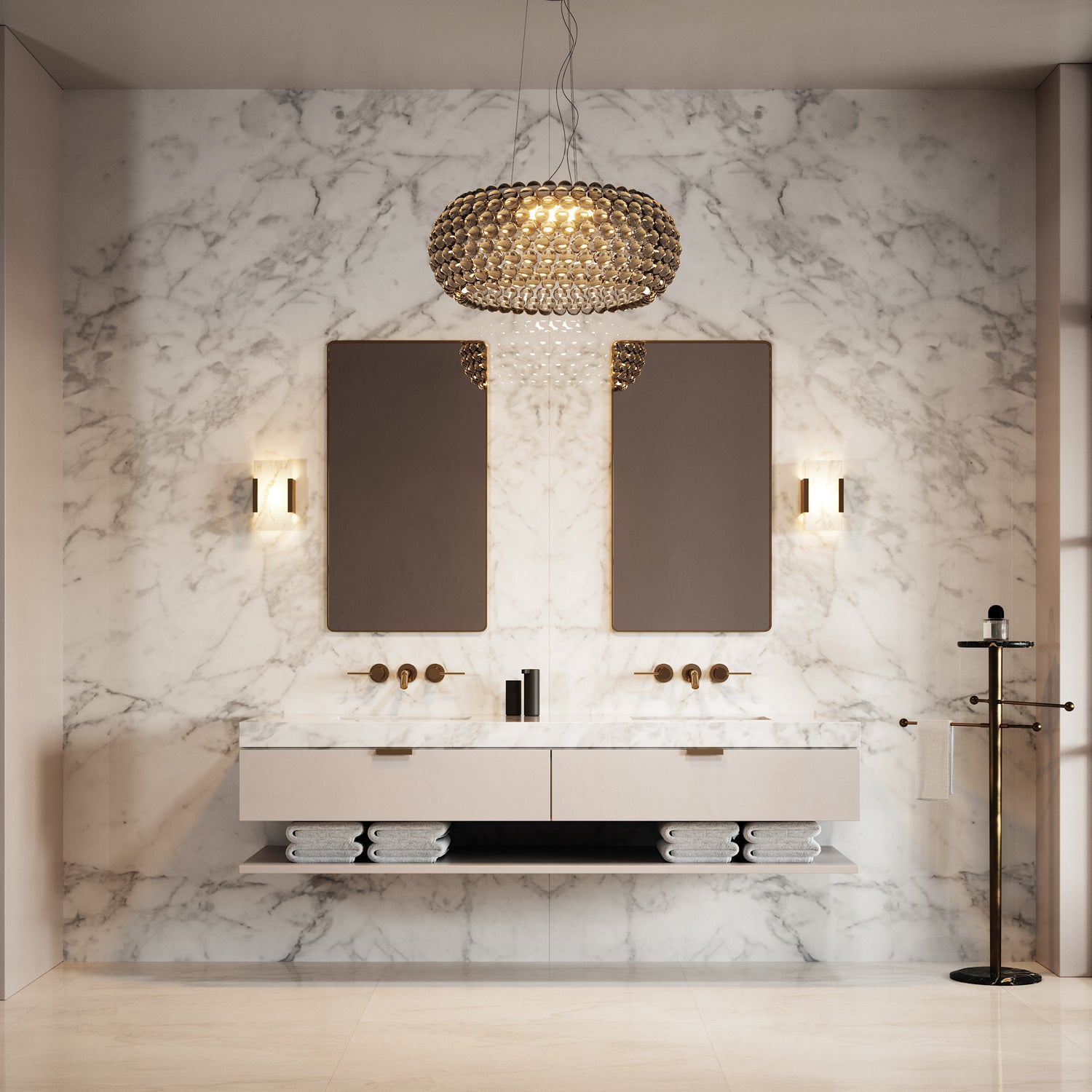 Granite-walled bathroom scene with a blown glass chandelier pendant between two mirrors