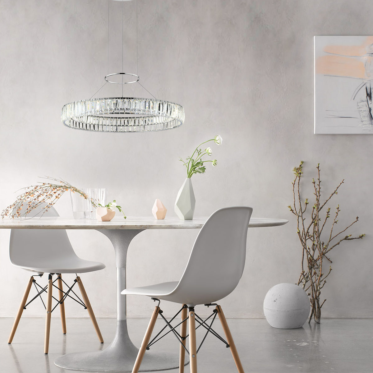 Circular chandelier over white mid-century modern dining scene 