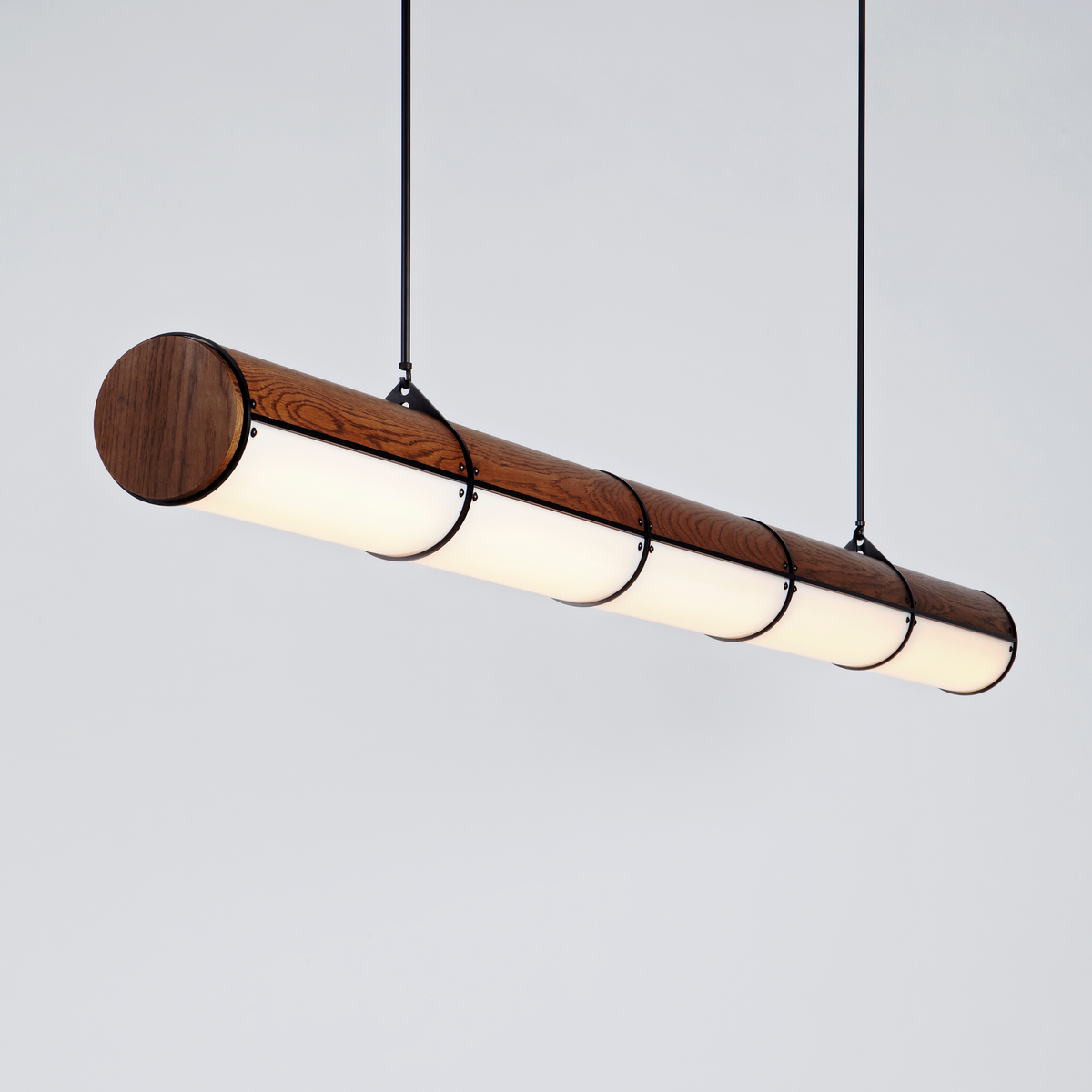 Wood and glass linear suspension.