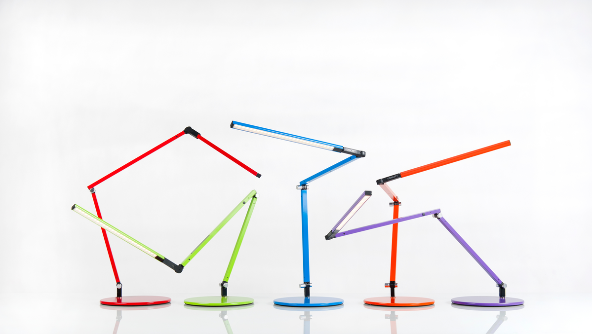 Multi-colored angular task lamps with a white background.