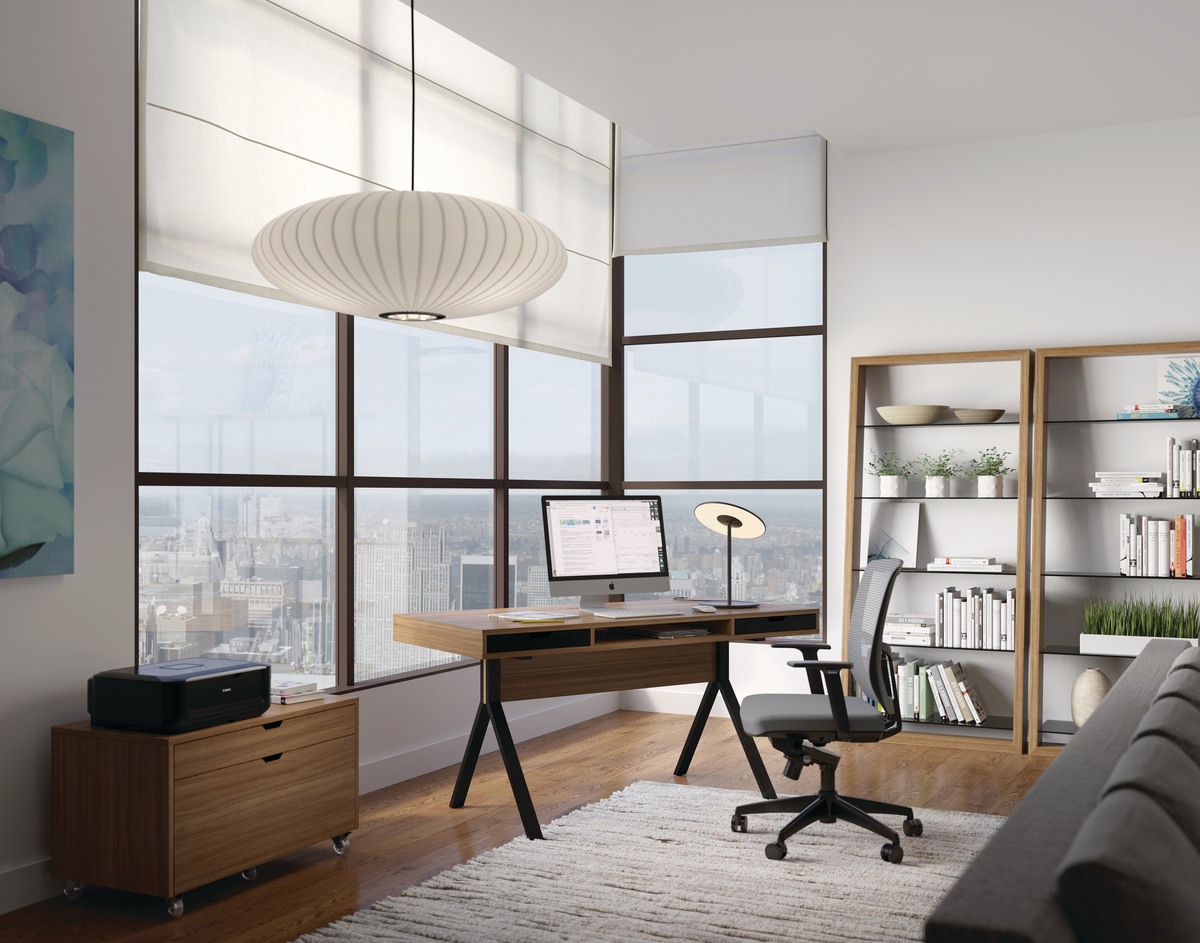 Office setting with large windows and white pendant lighting