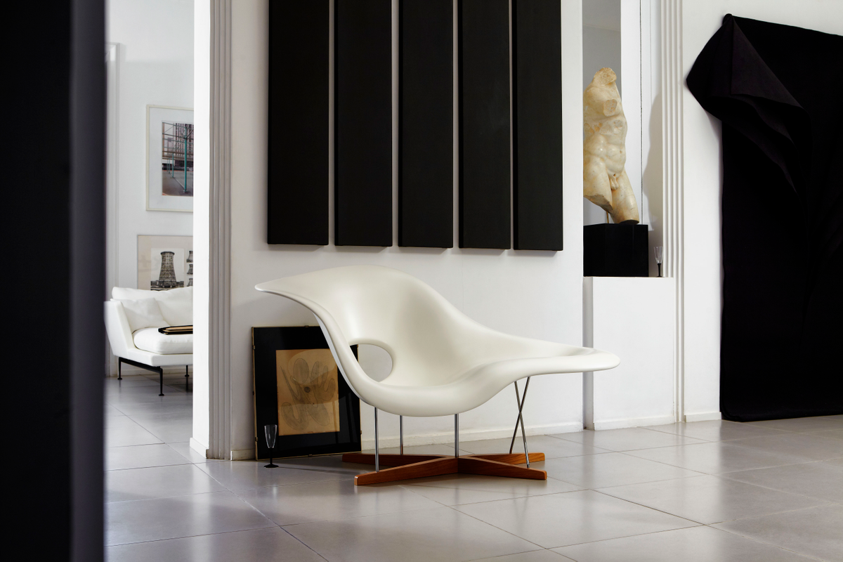 Abstract white chair with wood base in black and white modern room