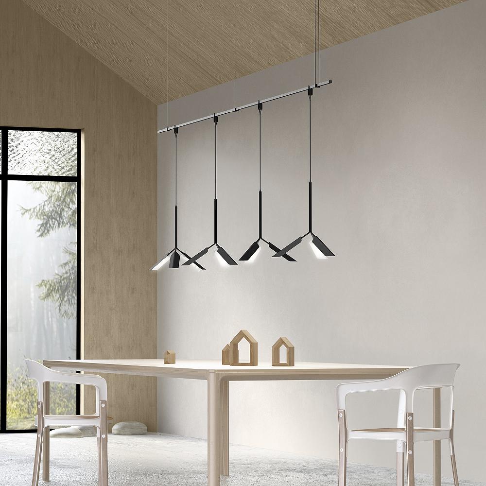 Sleek arrangement over minimalist dining space.