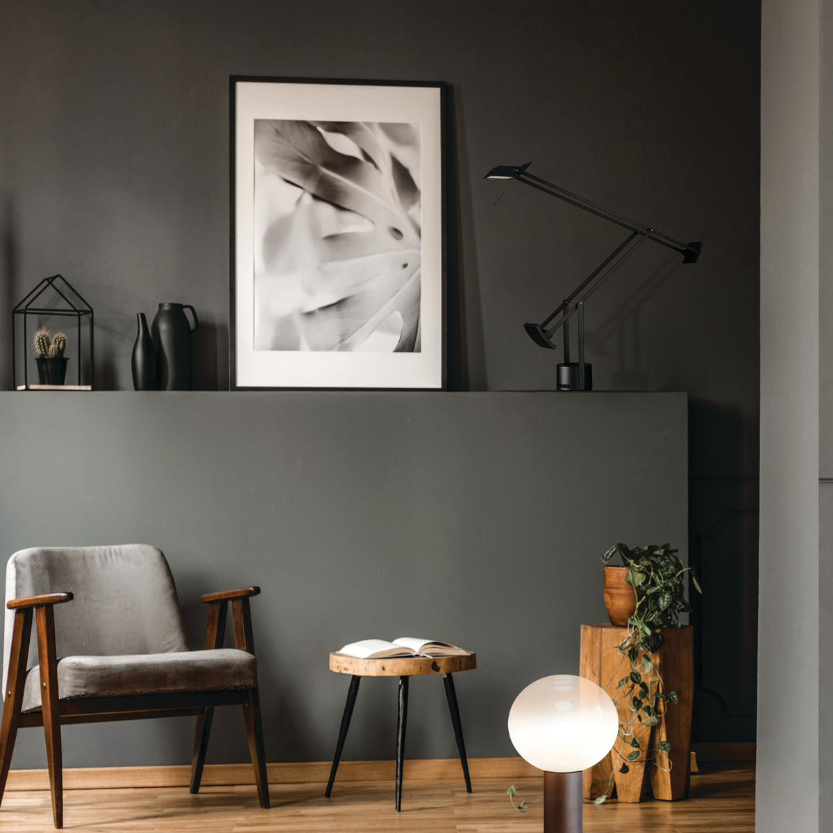 Black task lamp in gray living room with natural wood accents.