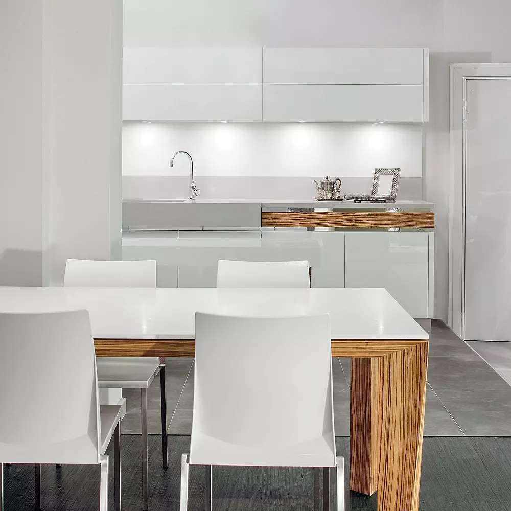 Power Puck LED Under-Cabinet Light by DALS Lighting in a white kitchen.