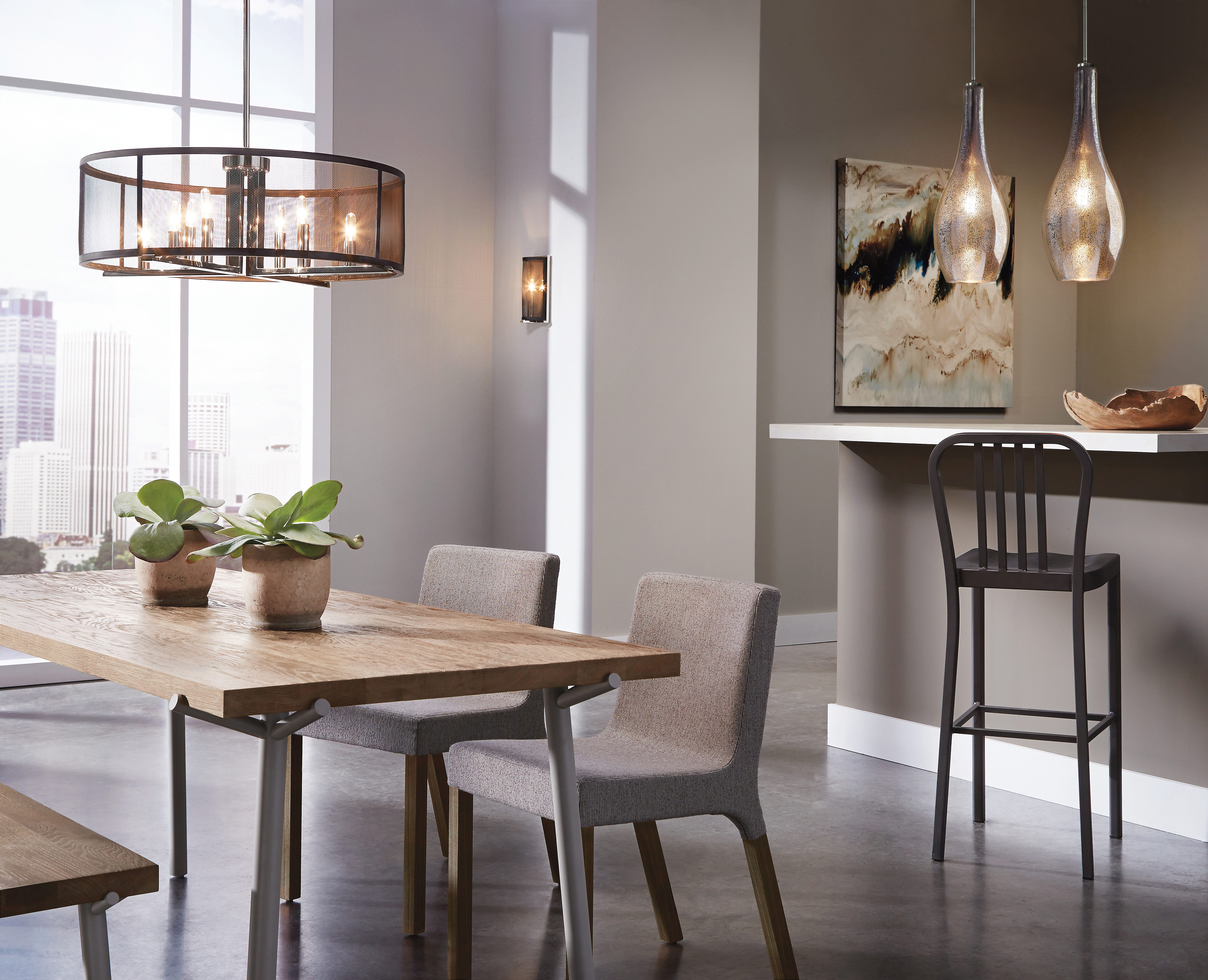 A cozy dining space lit by hanging pendants and chandelier.