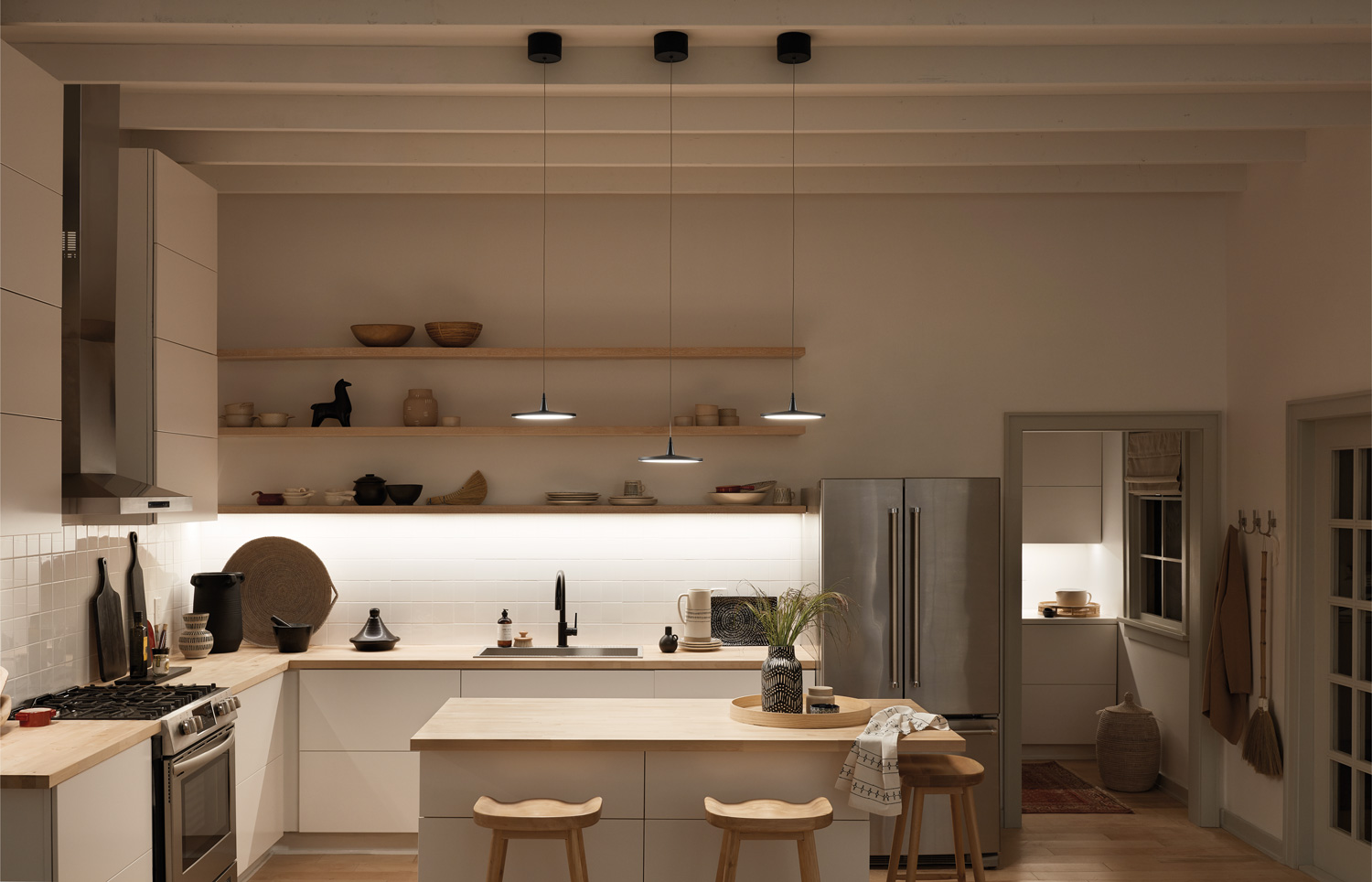 Jeno LED Mini Pendants over a kitchen island.