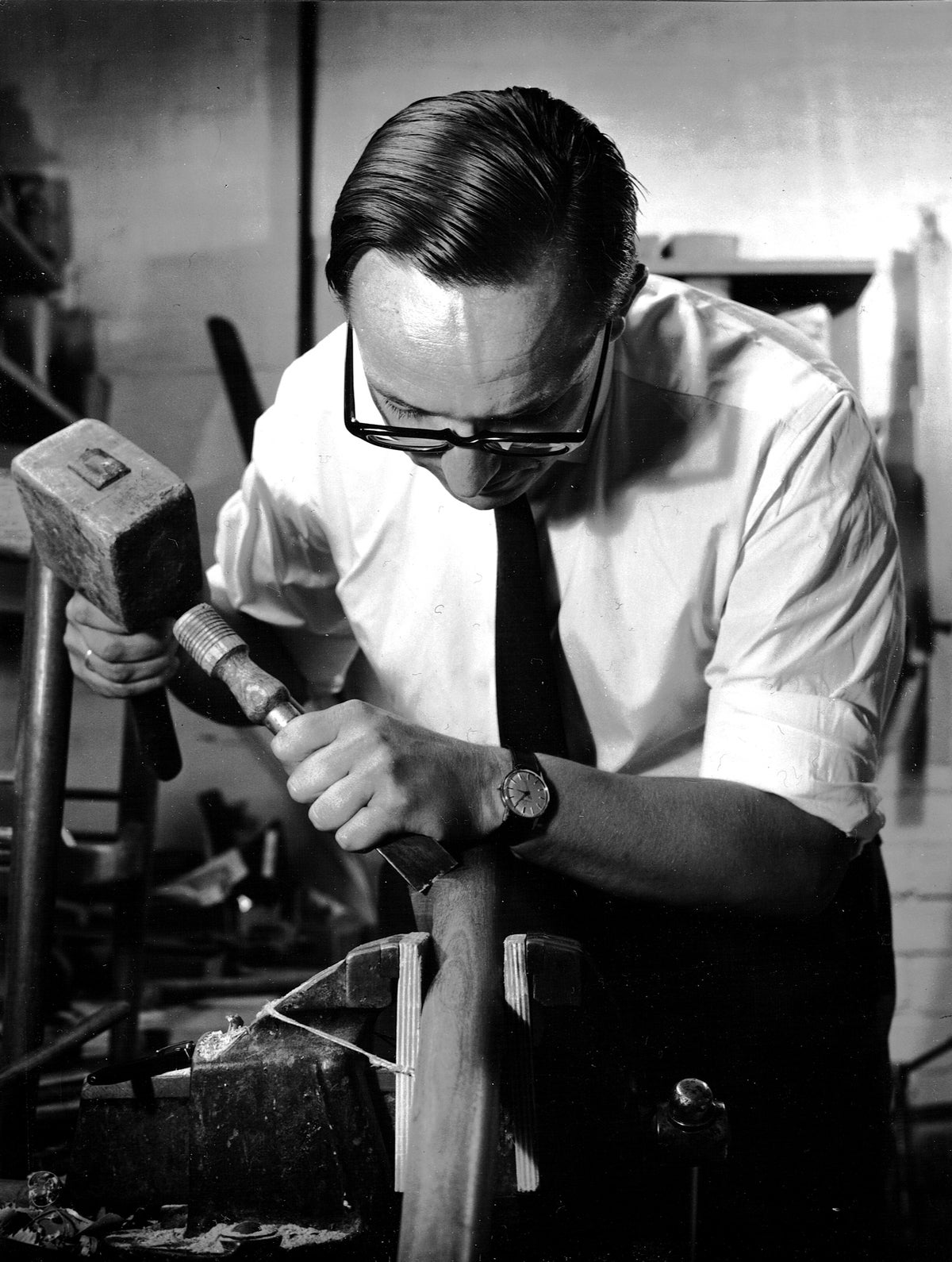 Black and white photo of designer with tools